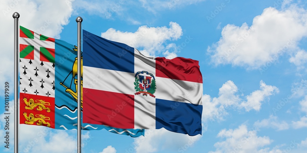 Saint Pierre And Miquelon and Dominican Republic flag waving in the wind against white cloudy blue sky together. Diplomacy concept, international relations.