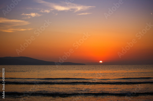 Fototapeta Naklejka Na Ścianę i Meble -  Beautiful sunset over the ocean. Summer landscape.