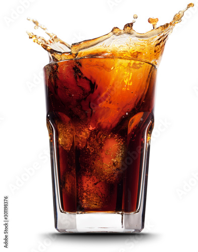 Cola splashing out of a glass., Isolated white background. photo