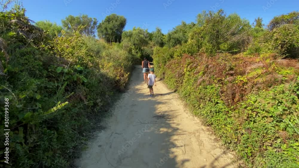 mother and child walking on a nature trail in greece mother and child walking on a nature trail in greece