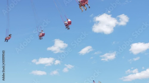 low angle handheld shot of coney island amusement park on a sunny day during summer photo