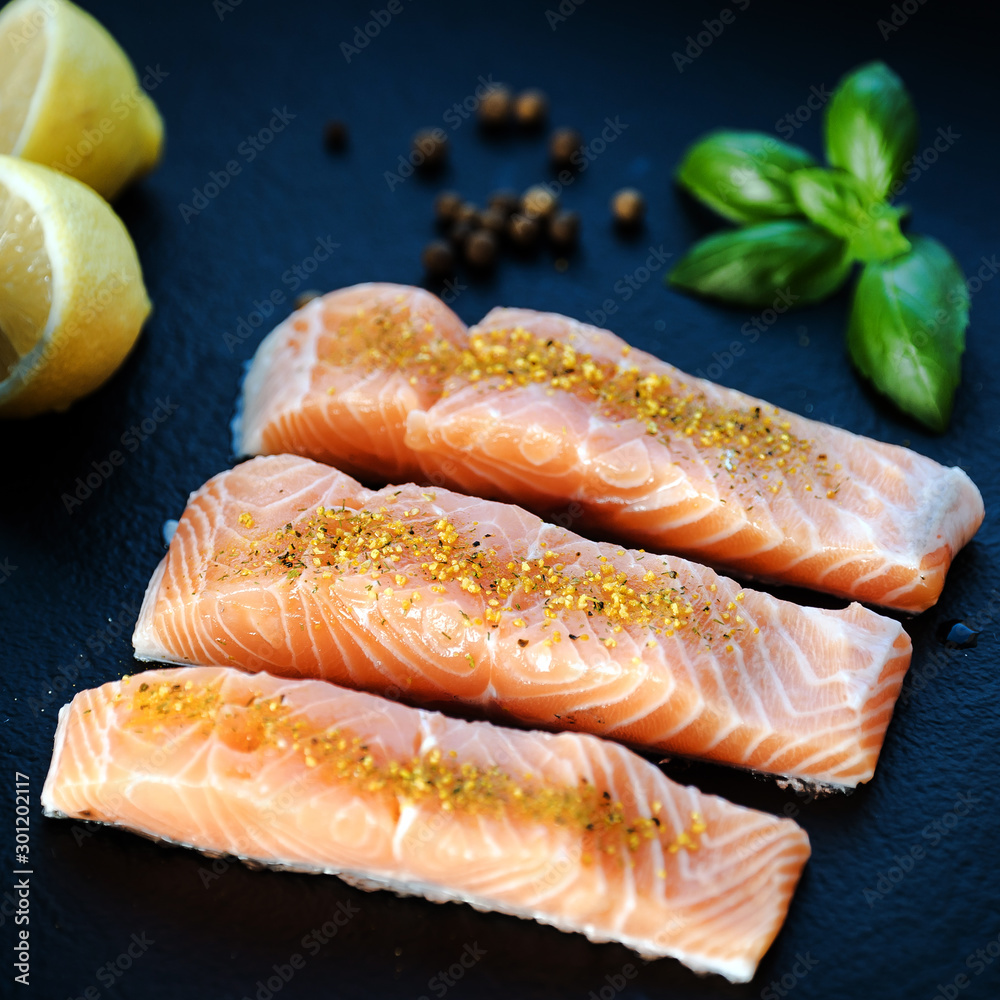 Fresh fish. Salmon fillet on black. Fresh fish. Salmon fillet on black.