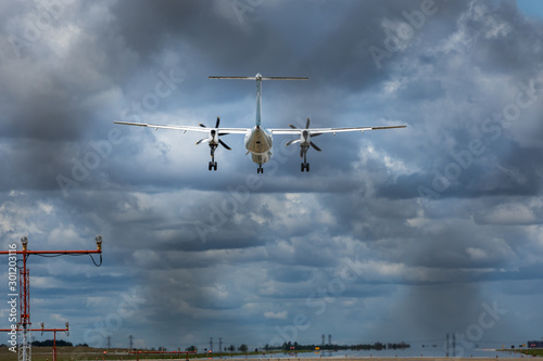 Propeller airplane flying in the cloudy skies