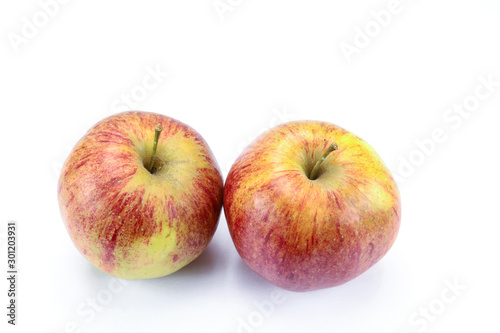yellow and red apple on a white background
