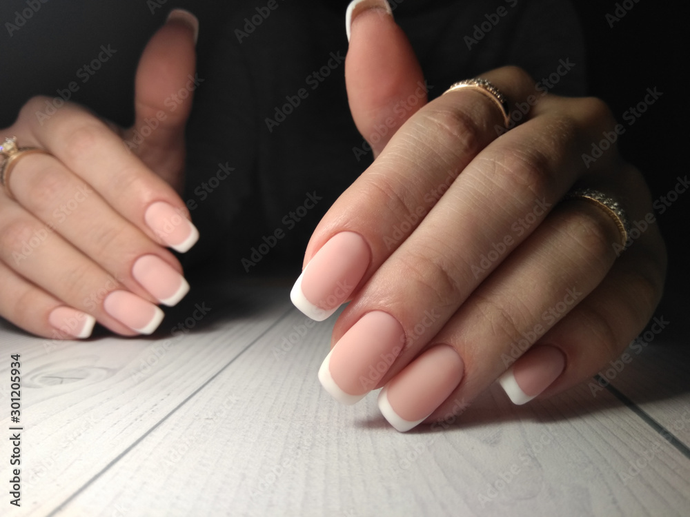 French manicure. Matte gel lacquer pink color with french design. French manicure. Matte gel lacquer pink color with french design.