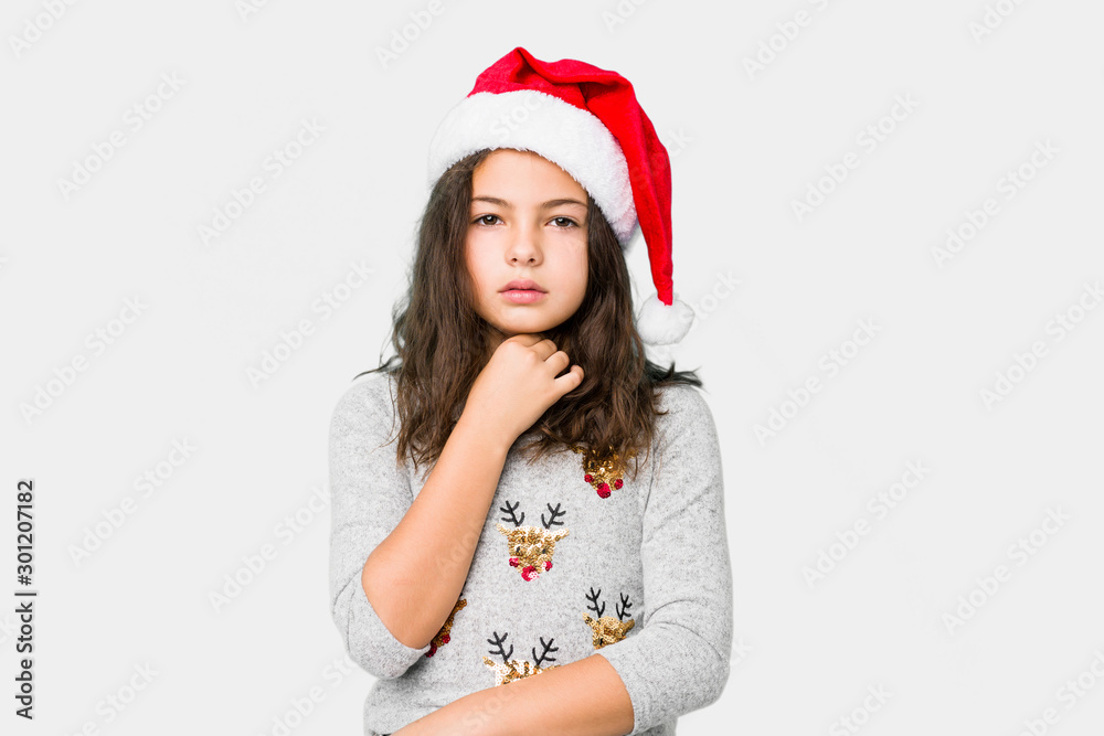 Little girl celebrating christmas day suffers pain in throat due a virus or infection. Little girl celebrating christmas day suffers pain in throat due a virus or infection.