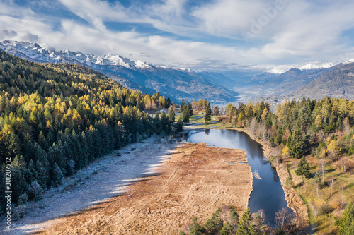 Alpine lake in mountain, natural reserve in Valtellina.  Pian di Gembro - Alps