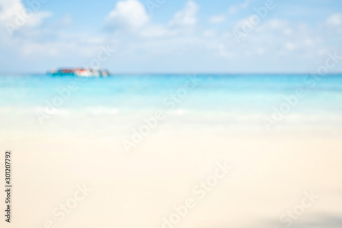 Blur summer white sand beach with sparkling sea water © яна винникова