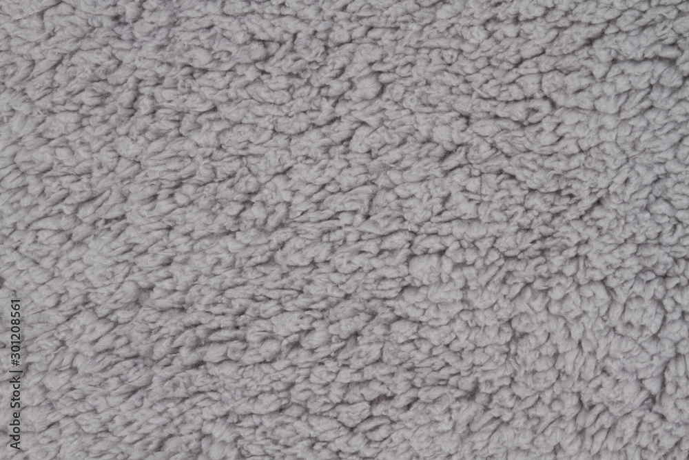 Gray sherpa textured plush fabric material background Gray sherpa textured plush fabric material background