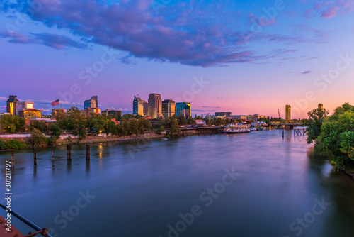 Skyline of Sacramento, California, USA at Dusk with Sacramento river and Tower Bridge photo