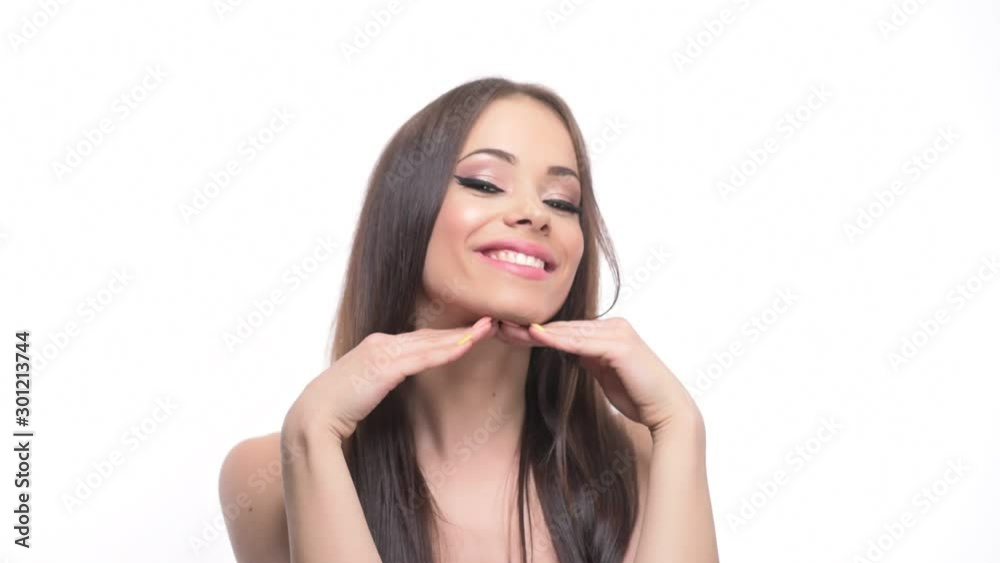 Stunning young perfect girl beauty model posing with hands under chin isolated on white background. Stunning young perfect girl beauty model posing with hands under chin isolated on white background.