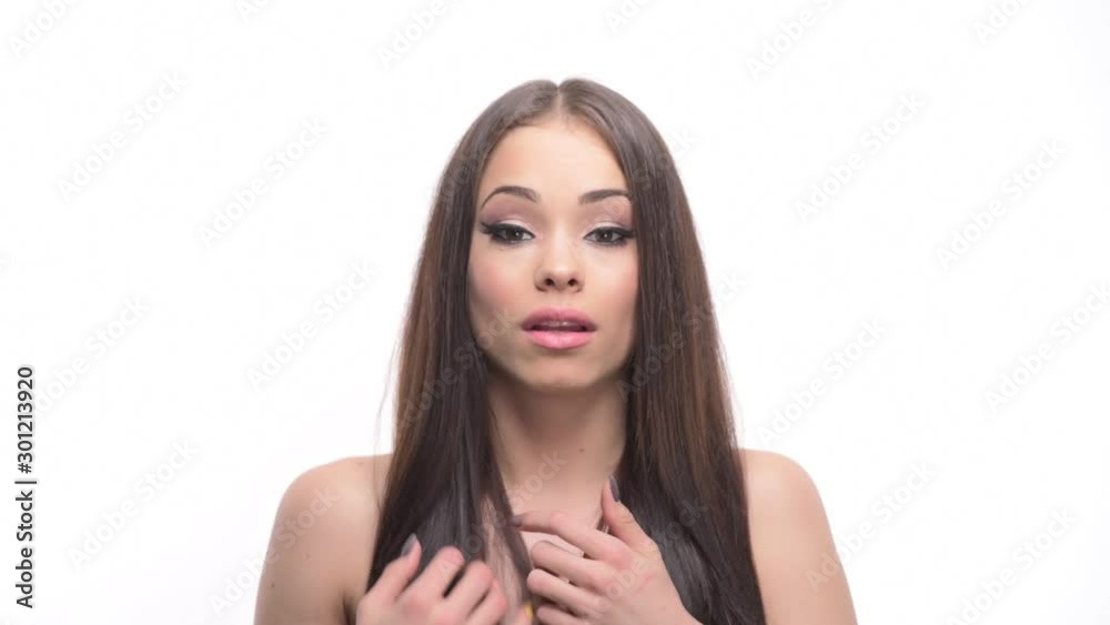 Shocked or scared young pretty woman looking at camera with hand on heart isolated on white background. Shocked or scared young pretty woman looking at camera with hand on heart isolated on white background.
