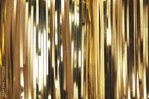 Golden foil tinsel strips. photo