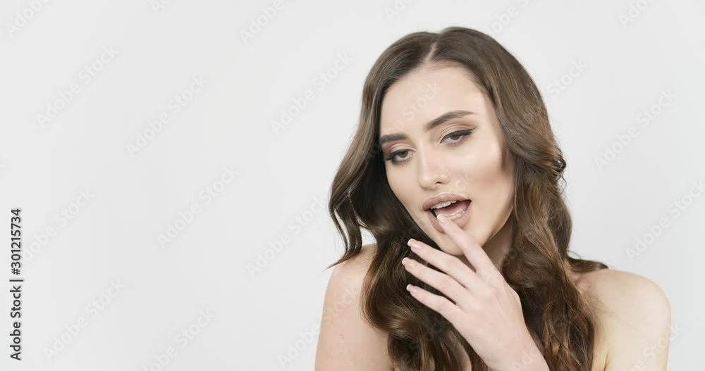 Attractive sensitive brunette lady posing to camera isolated on white background, trendy makeup, advertisement template Attractive sensitive brunette lady posing to camera isolated on white background, trendy makeup, advertisement template