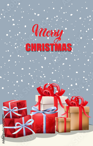 Merry Christmas red gift boxes with ribbon. Green fir tree leaves. Snowy back...