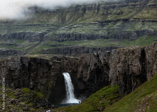 waterfall in the mountains in Iceland