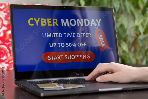 Girl makes purchases over the internet on cyber mondey