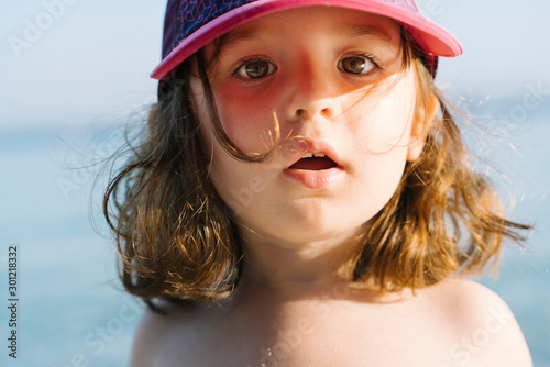 Portrait of little girl wearing cap on the beach