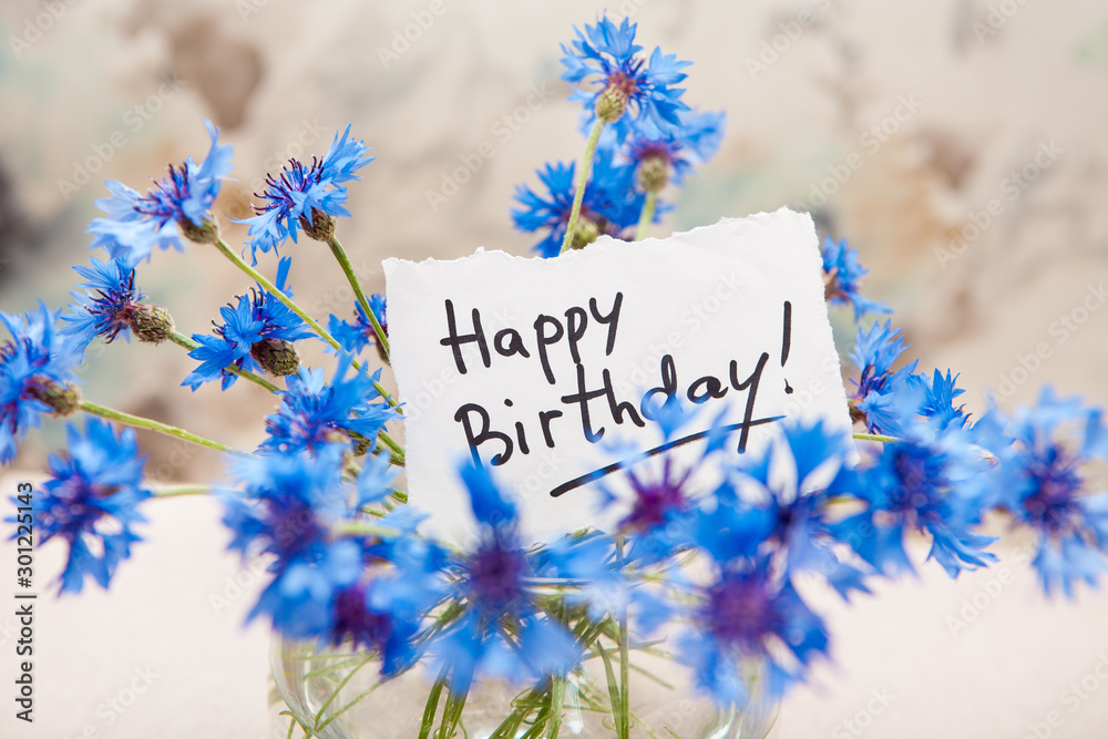 Happy birthday card with greeting words and bouquet of blue cornflower ...