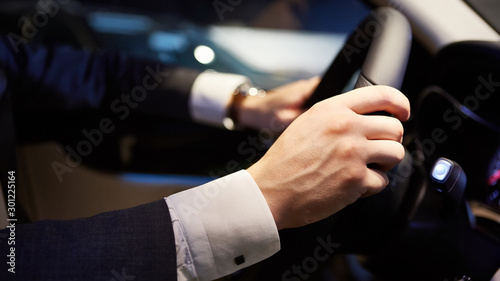 hands on a steering wheel