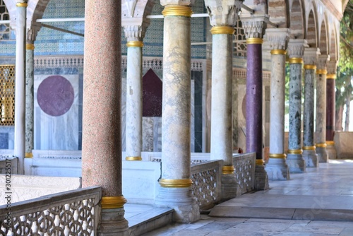 Beautiful colonnade of various breeds of natural stone in the Dolmabahçe Palace. Colorful Natural stone columns with selective focus 