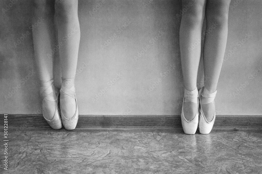 Close-up of ballerina on pointe shoes in the dance hall. Vintage photography. Close-up of a ballerina in the dance hall. Black and white photography. Stock Photo | Adobe Stock