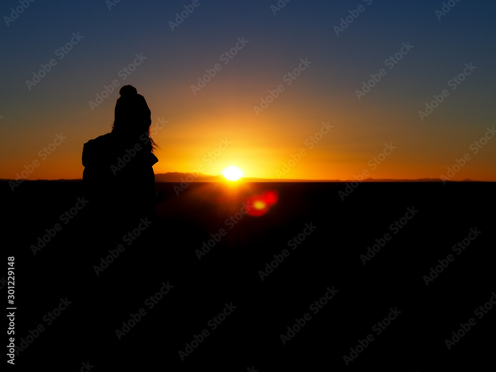 Silhouette of a women in the Desert of salt of Uyuni, Bolivia