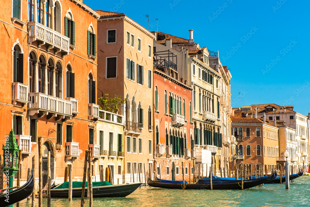 Venice Grand Canal with colorful facades of old medieval houses , Italy. Venice is a popular tourist destination of Europe.