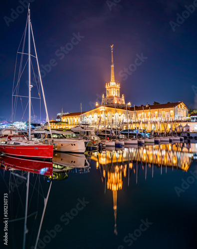 Slika na platnu Marine Station of Sochi, illuminated with lights at night with reflection in water