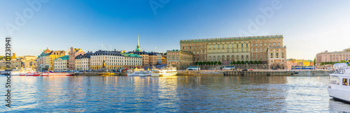 Panoramic view of Old  town Gamla Stan historical quarter with Royal Palace eastern facade (Stockholm slott or Kungliga slottet) on Stadsholmen island, boats in Lake Malaren, Stockholm, Sweden photo