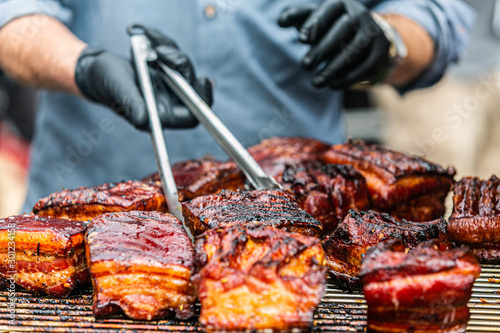 The chef prepares delicious roasted meat. Closeup of a fresh roasted meat