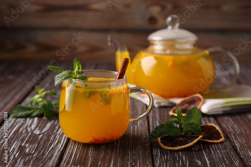 Hot sea buckthorn tea with mint, cinnamon and honey, a delicious preventive measure for colds, and to strengthen the immune system.