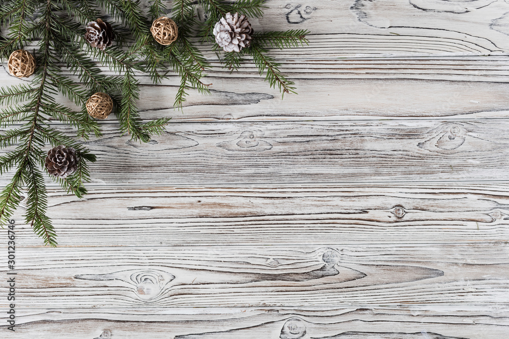 spruce branches, christmas tree, cones and decorations on rustic wood brown, white and gray burned planks. New Year. Flat lay, top view. spruce branches, christmas tree, cones and decorations on rustic wood brown, white and gray burned planks. New Year. Flat lay, top view.