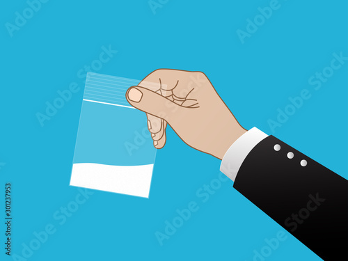 Hand holding plastic bag filled with white powder