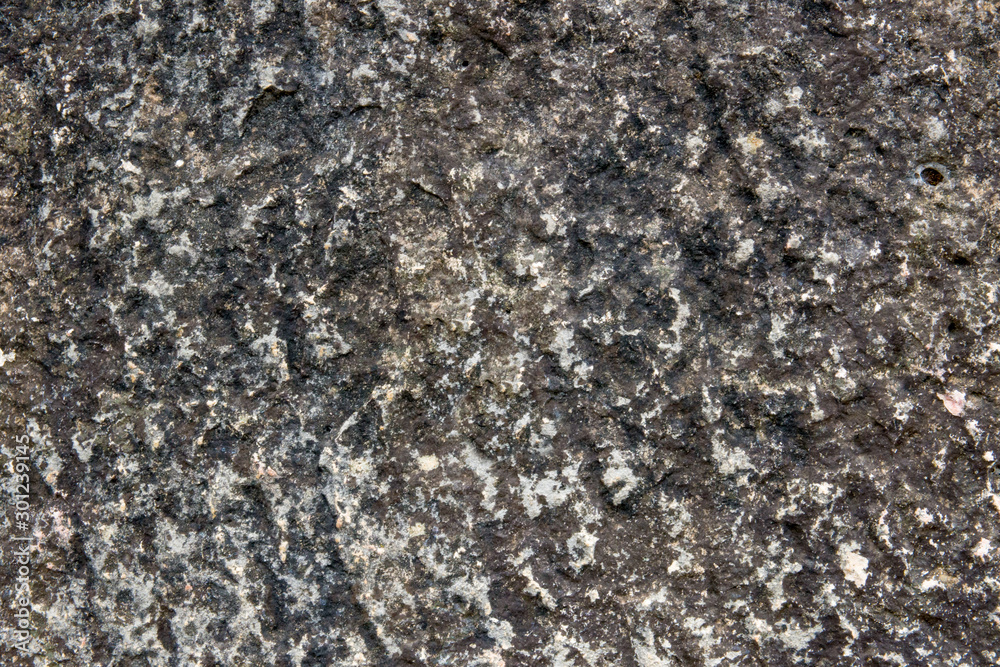The rough gray texture of the stone. Gray stone surface The rough gray texture of the stone. Gray stone surface