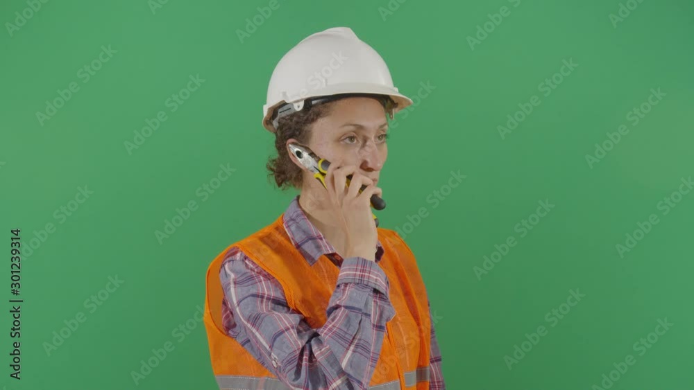 Woman Engineer Talking On Pliers Phone Woman Engineer Talking On Pliers Phone