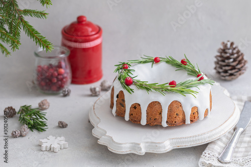 Traditional homemade Christmas fruit cake on the concrete background photo