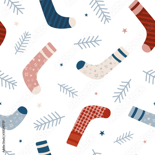 Seamless vector pattern with Christmas socks. Seamless pattern for cards, wrapping papers, posters. Creative hand drawn pattern for winter holidays. Seamless texture for Christmas design