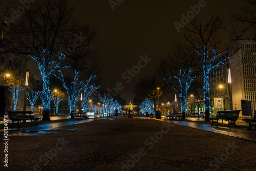 Street in Berlin at Christmas time, rainy weather, wet street, street with Christmas lights, Unter den Linden, Berlin, Lensflares, rain drops on lens