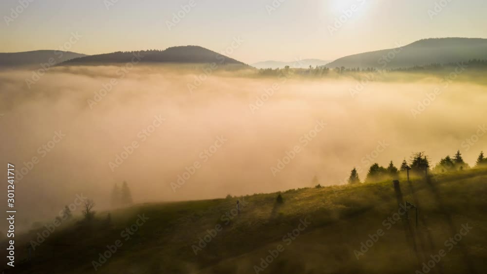 Misty dawn in the mountains. Beautiful landscape