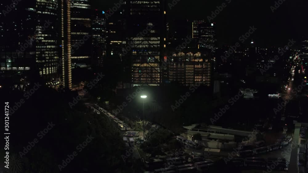 Aerial night view of the tallest skyscrapers in CDMX, drone panning right to left. Aerial night view of the tallest skyscrapers in CDMX, drone panning right to left.