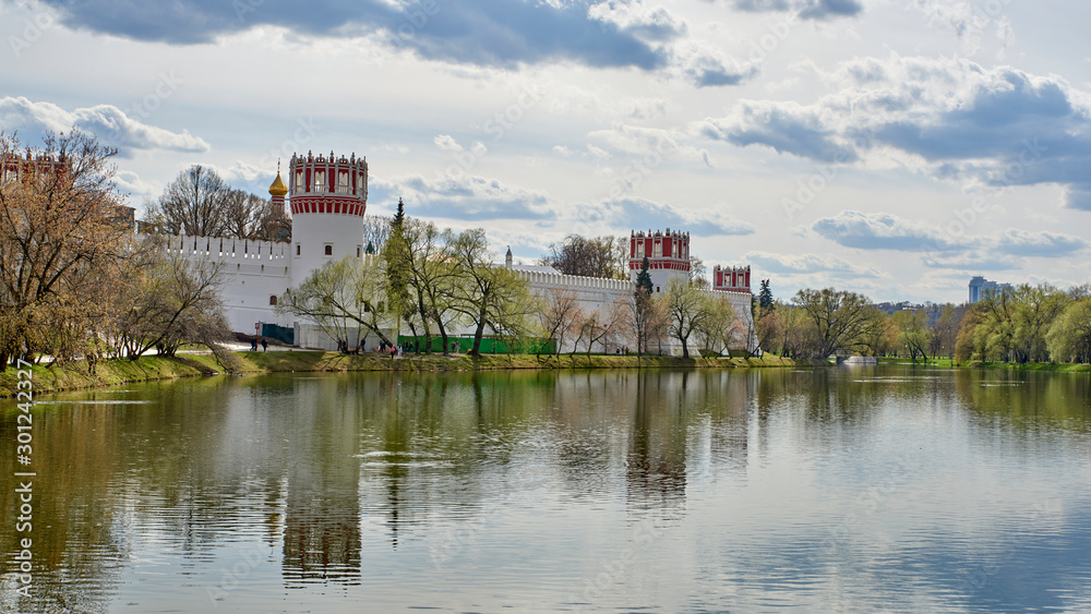 Russia. Moscow in the spring. Walls and towers of the Novodevichy Convent beyond the Great Novodevichy Pond