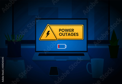 Power outage, warning banner on the laptop screen and triangular icon of electricity in the office workspace