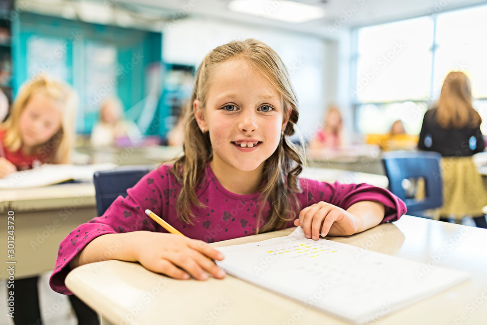 education and school concept little student girl studying at school education and school concept little student girl studying at school