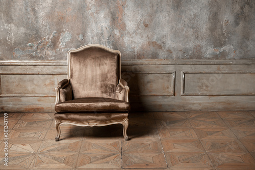 old armchair against a vintage wall