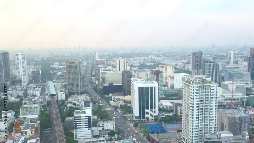 Aerial view of Bangkok downtown. Real estate development Asia. Financial district and business centers in smart urban city, Flying over Bangkok, Thailand Aerial view of Bangkok downtown. Real estate development Asia. Financial district and business centers in smart urban city, Flying over Bangkok, Thailand