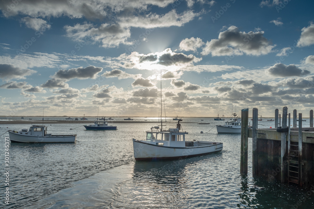 Fototapeta premium Boats at rest in harbor near Chatham MA