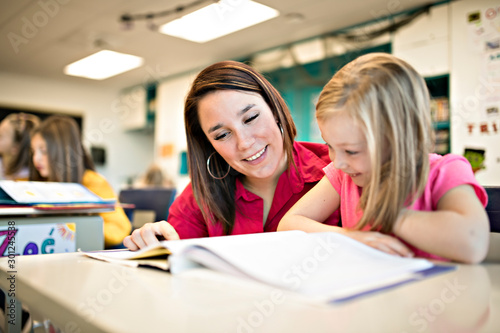 education and school concept little student girl studying at school