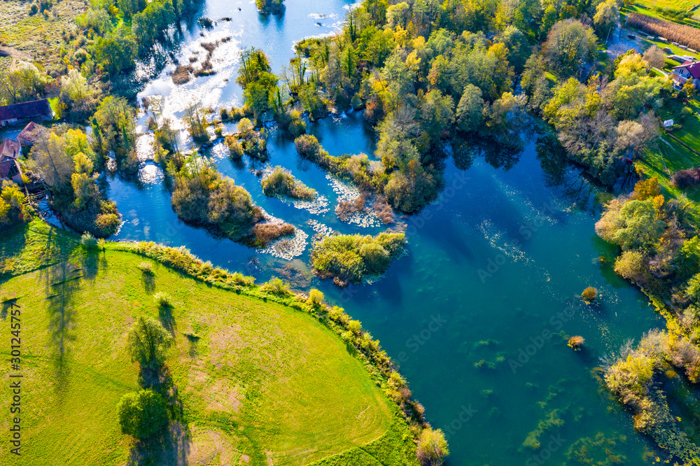 Panoramic view of Mreznica river in autumn from drone, green landscape and waterfalls, Croatia, popular touristic destination Panoramic view of Mreznica river in autumn from drone, green landscape and waterfalls, Croatia, popular touristic destination