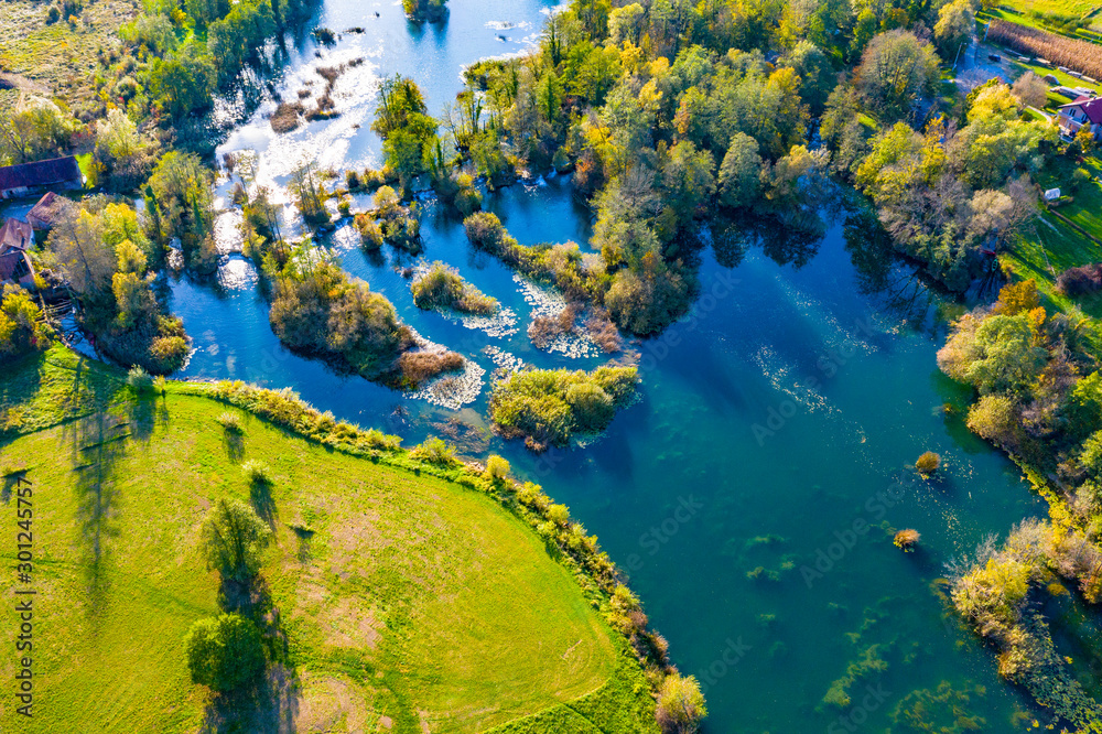 Panoramic view of Mreznica river in autumn from drone, green landscape and waterfalls, Croatia, popular touristic destination